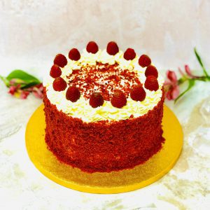 Luxury handmade red velvet birthday cake with strawberry and cream cheese topping