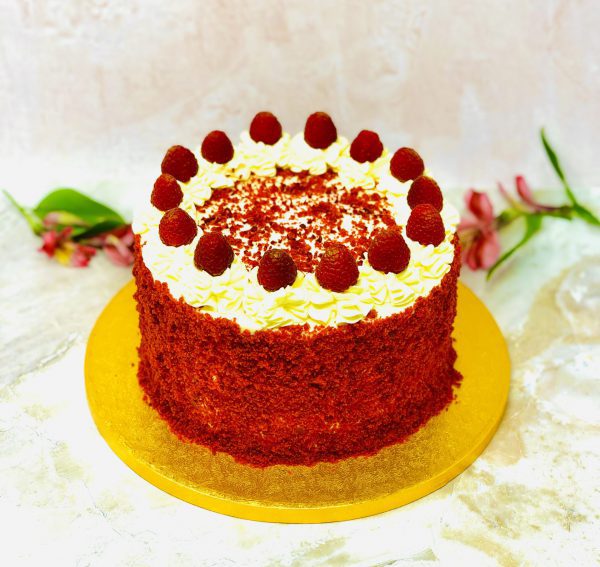 Luxury handmade red velvet birthday cake with strawberry and cream cheese topping