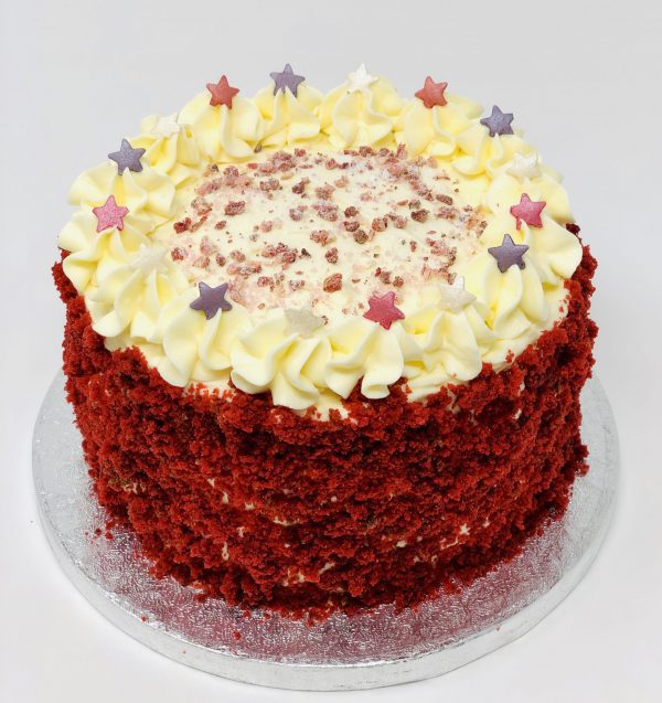Luxury red velvet handcrafted birthday cake with star sprinkles