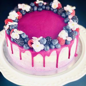 Close up of handmade Lemon and Blueberry celebration cake with fruits