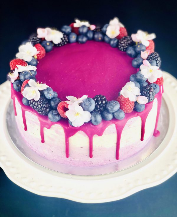 Close up of handmade Lemon and Blueberry celebration cake with fruits