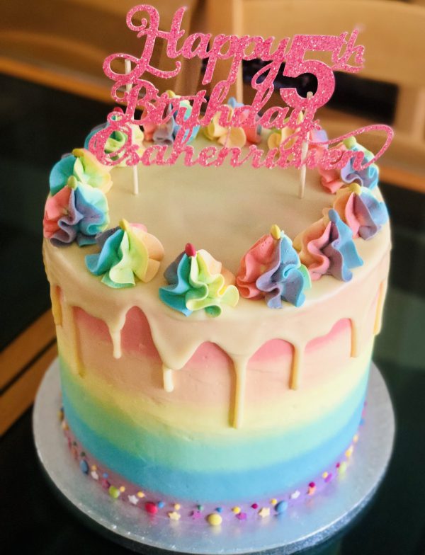 Luxury rainbow birthday drip cake with homemade icing