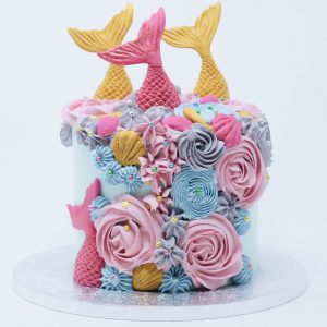 Colourful rainbow mermaid childrens celebration cake