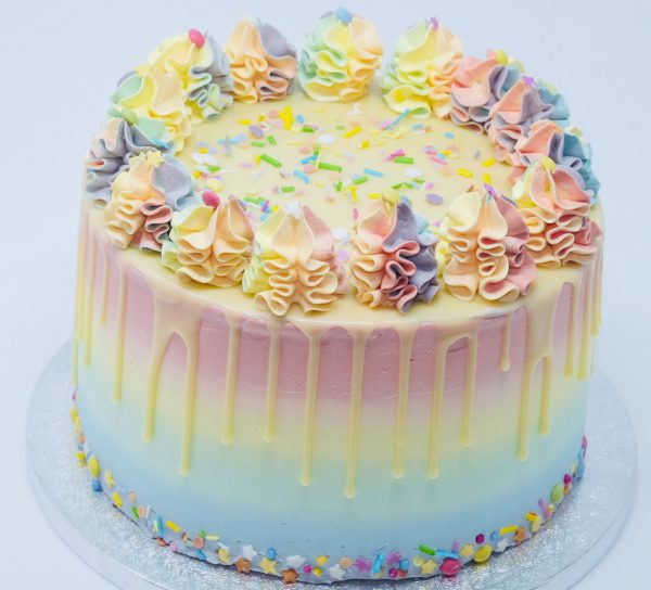 Unique luxury colourful rainbow birthday drip cake