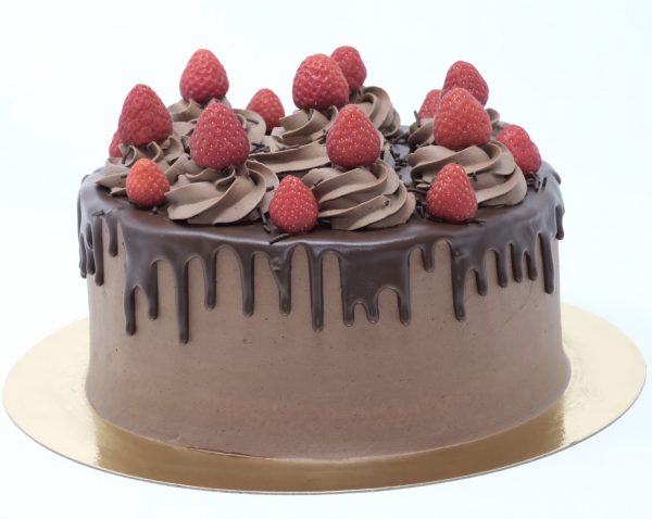 Luxury handcrafted chocolate ganache drip cake topped with strawberries