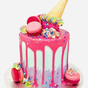 Extravagant vibrant pink ice cream cone birthday cake