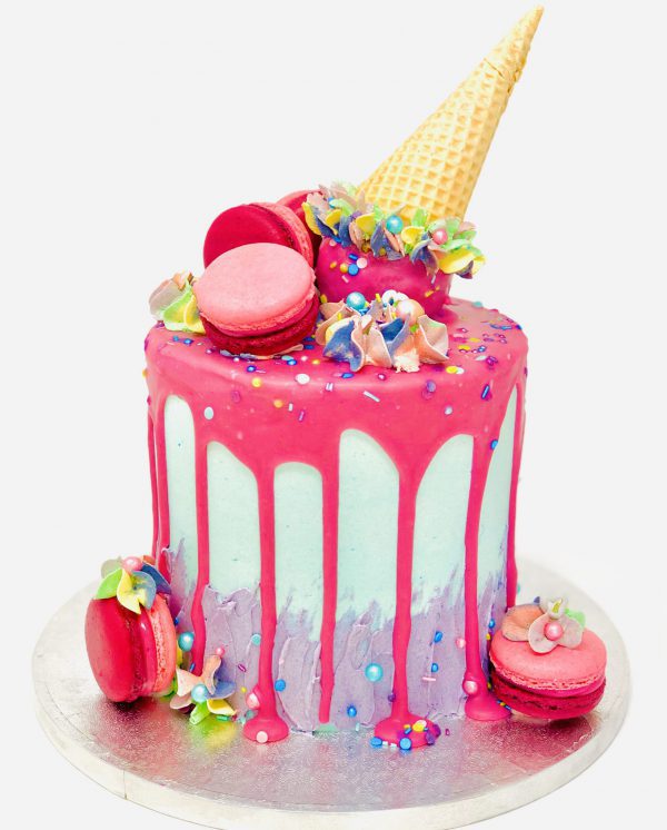 Extravagant vibrant pink ice cream cone birthday cake