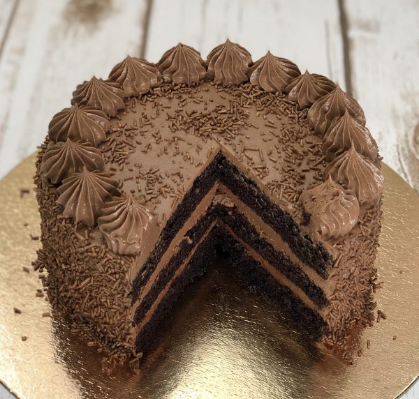 Sliced handcrafted gourmet chocolate ganache cake