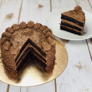 Decadent silky artisan chocolate ganache sliced cake