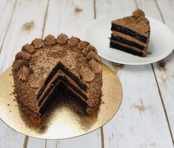 Decadent silky artisan chocolate ganache sliced cake