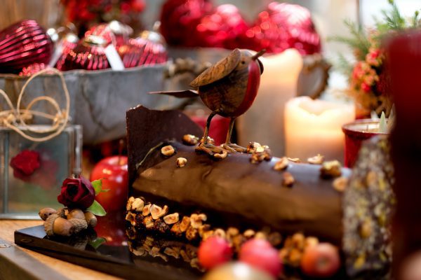 Gourmet Christmas chocolate yule log with robin topping