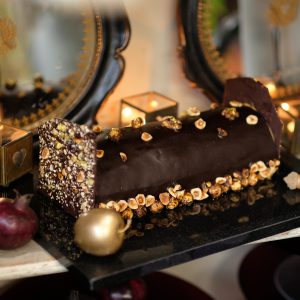 Gourmet christmas chocolate yule log with nut topping