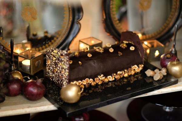 Gourmet christmas chocolate yule log with nut topping