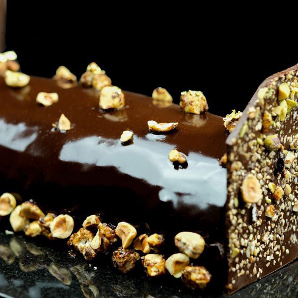 Decadent gourmet Christmas chocolate log with nuts
