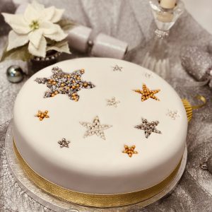 Handmade traditional Christmas fruit cake with decorative topping