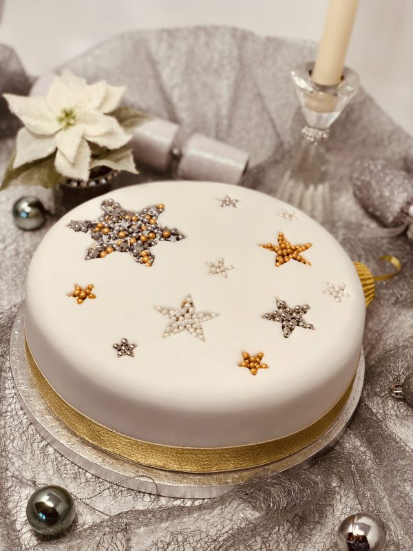 Handmade traditional Christmas fruit cake with decorative topping