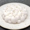 Unique handmade white Christmas cloud cake topped with stars