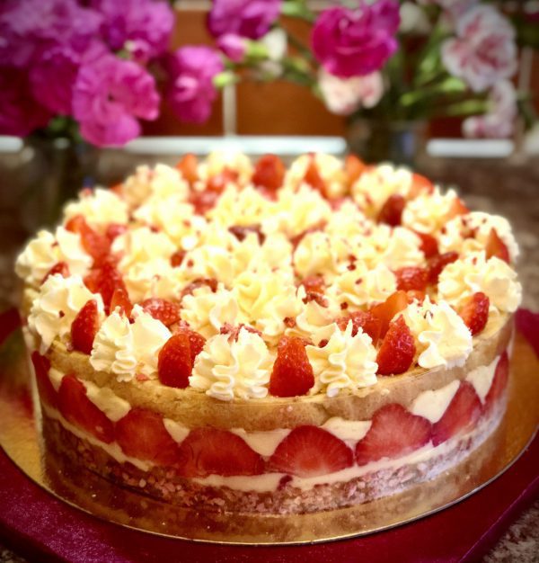 Freshly baked Fraisier classic French cake with cream and fresh strawberries