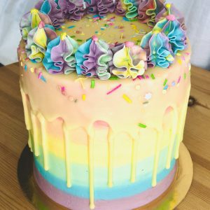 Handmade colourful rainbow pinate birthday cake