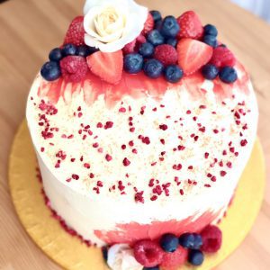 Elegant bespoke strawberry cake with fresh berries