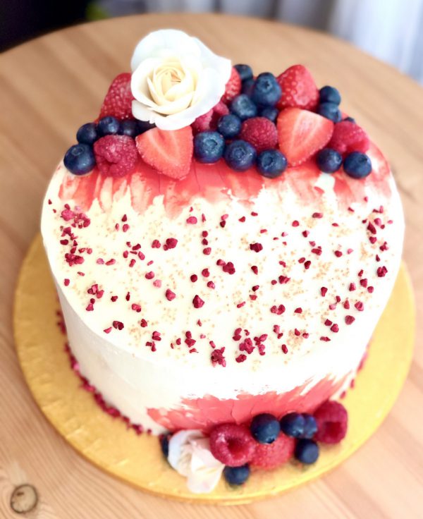 Elegant bespoke strawberry cake with fresh berries