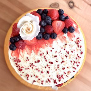 Handcrafted gourmet strawberry and vanilla cake with berries