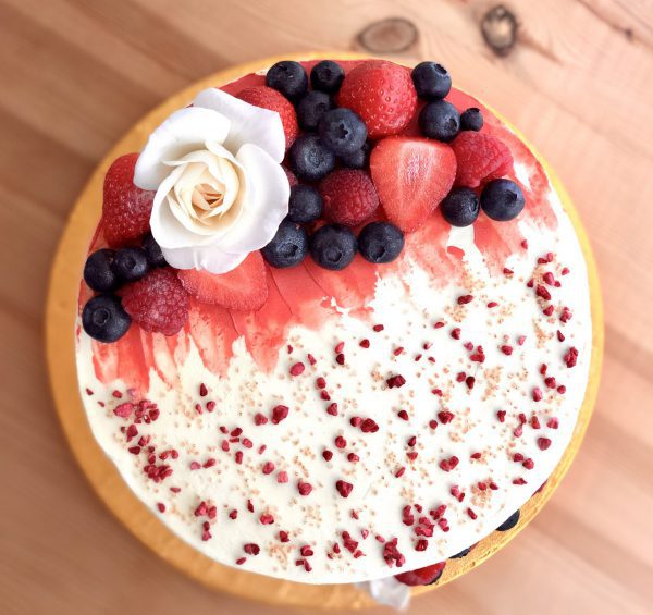 Handcrafted gourmet strawberry and vanilla cake with berries