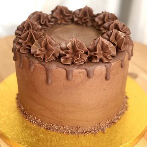 Rich and decadent chocolate ganache celebration cake with drip topping