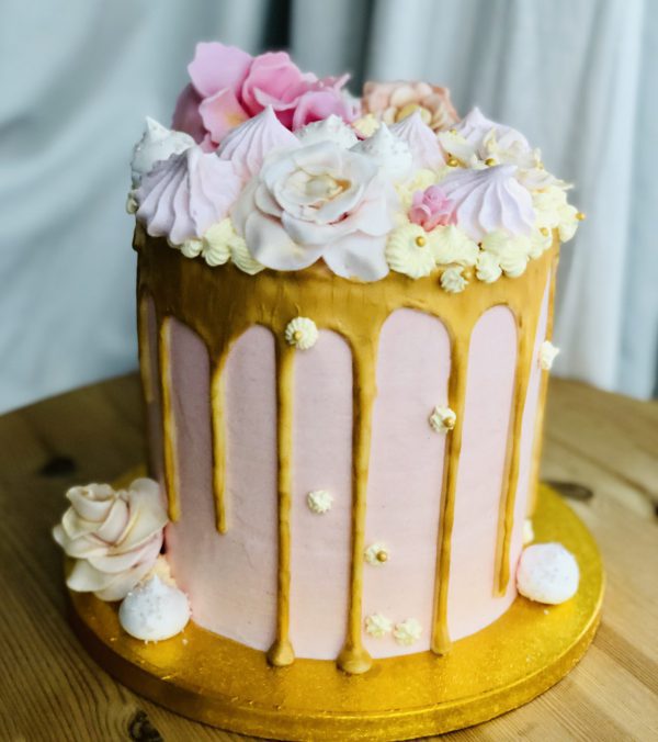 Showstopping handmade pink and gold birthday drip cake