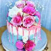 Beautiful gourmet birthday cake with fresh roses and pink French macarons