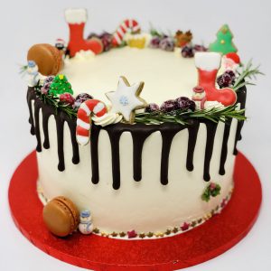 Handcrafted Christmas dessert cake with chocolate ganache drip