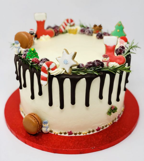 Handcrafted Christmas dessert cake with chocolate ganache drip