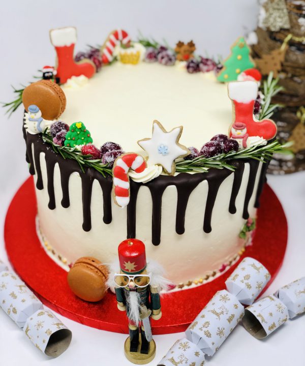 Festive Christmas cake handcrafted with christmas decorations